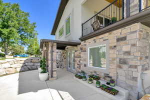 View of patio / terrace featuring a balcony and french doors