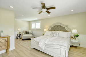 Bedroom featuring light hardwood / wood-style floors and ceiling fan