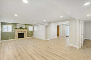 Unfurnished living room with light hardwood / wood-style floors