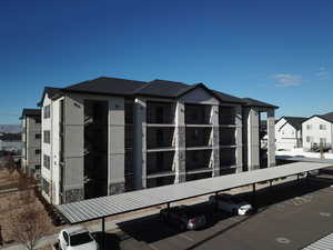 View of side of home featuring a carport