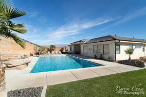 View of swimming pool featuring a patio area and a mountain view