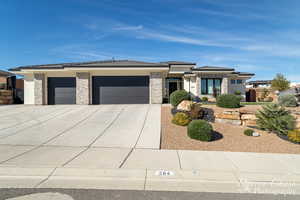 Prairie-style home featuring a garage