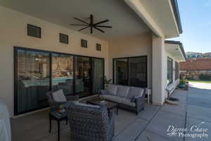 View of patio / terrace with an outdoor living space and ceiling fan