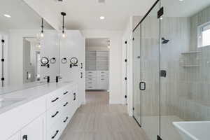 Bathroom with vanity and walk in shower