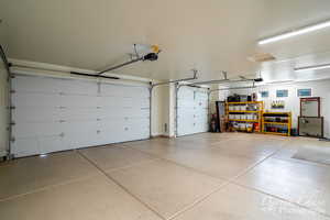 Garage featuring a garage door opener