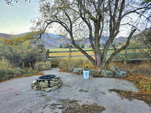 View of patio / terrace with a mountain view and an outdoor fire pit