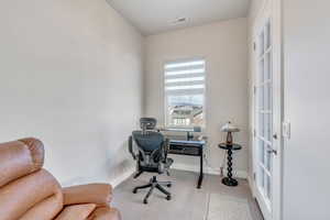 Office area featuring french doors