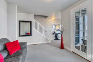 Foyer with carpet flooring