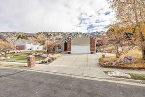 Ranch-style house with a mountain view and a garage