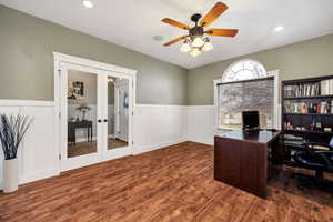 Office area featuring ceiling fan, french doors, and dark hardwood / wood-style floors