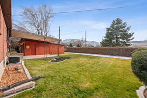 View of yard featuring a mountain view, a patio, and central AC