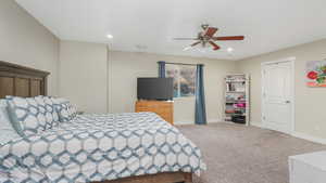 Bedroom featuring carpet flooring and ceiling fan