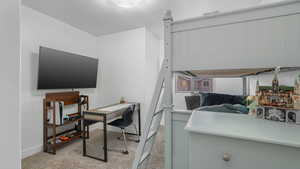 Carpeted bedroom with a textured ceiling