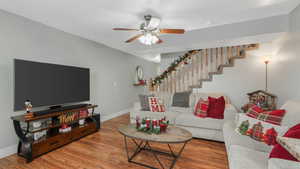 Living room featuring hardwood / wood-style floors and ceiling fan