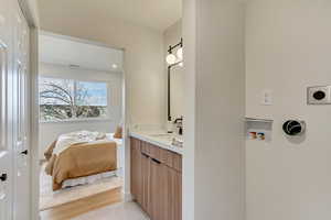 Bathroom with vanity and hardwood / wood-style flooring