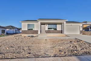 View of front of home featuring a garage