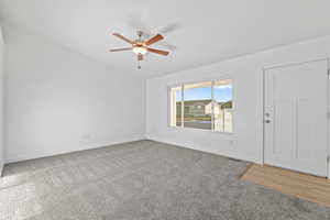 Interior space with carpet and ceiling fan