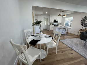 Dining area with light wood-type flooring