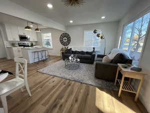 Living room with light hardwood / wood-style floors