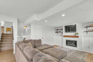 Living room featuring a fireplace and light wood-type flooring