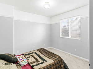 View of carpeted bedroom