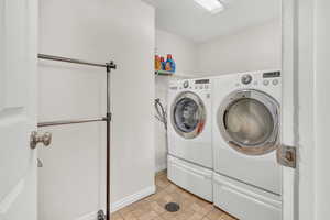 Laundry room featuring washing machine and dryer