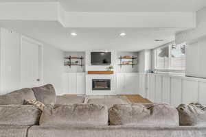 Living room featuring a fireplace and light hardwood / wood-style floors