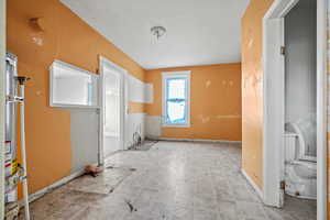 Kitchen featuring white cabinets