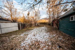 View of yard layered in snow