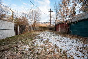 View of yard covered in snow