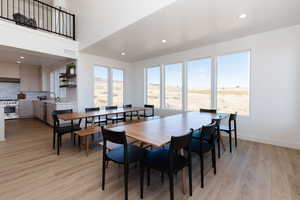 Dining space featuring light hardwood / wood-style flooring and sink