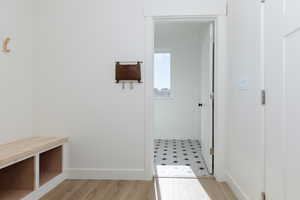 Mudroom with light wood-type flooring