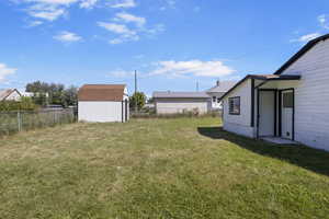 View of yard with a shed