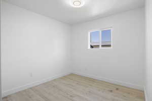 Spare room with light hardwood / wood-style flooring