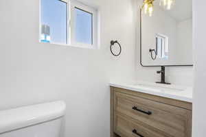 Bathroom with vanity and toilet