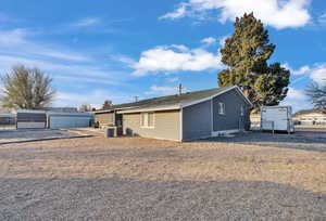 Ranch-style home with a storage shed