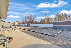 View of patio / terrace with a shed