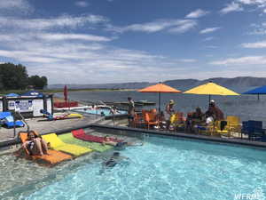 View of pool featuring a water and mountain view