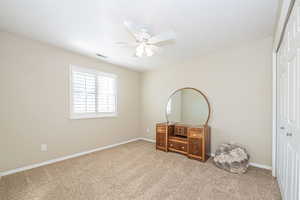 Second Bedroom with carpet flooring, a closet, and ceiling fan