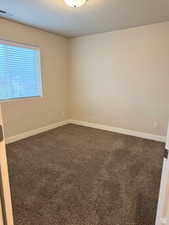 Spare room featuring carpet floors