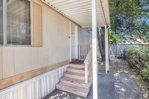 Entrance to property with a patio