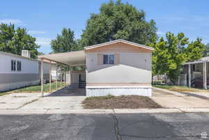 Manufactured / mobile home featuring a storage shed