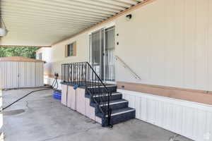 View of patio with a storage shed