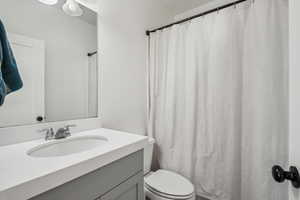 Bathroom with vanity and toilet