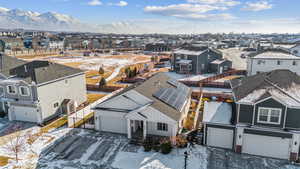 Snowy aerial view featuring a mountain view