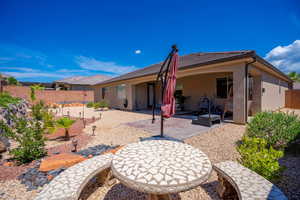 Back of house with a patio