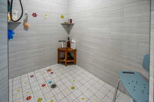 Large Walk-in tile shower and tile walls