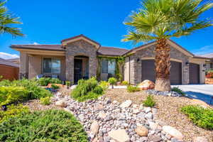 Ranch-style house featuring a garage