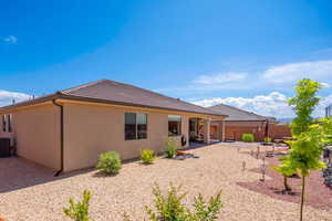 Rear view of house with a patio area and central air condition unit