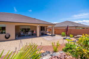 Rear view of house featuring a patio